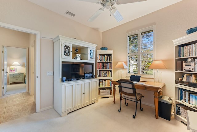 carpeted office with ceiling fan