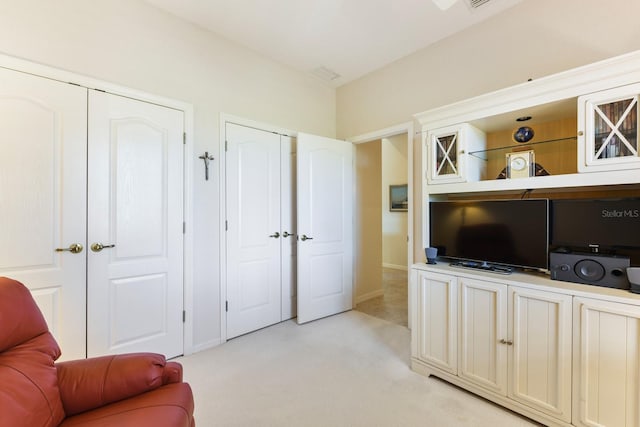 living area featuring light colored carpet