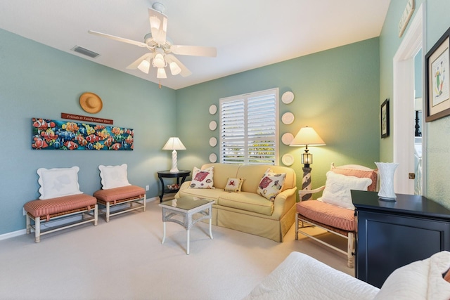 living room with carpet and ceiling fan