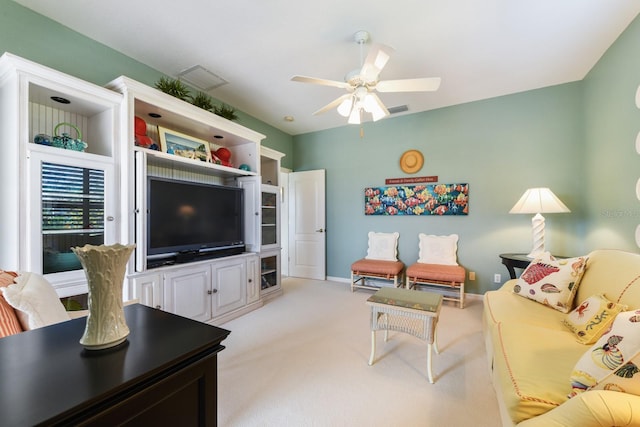 living room with light carpet and ceiling fan