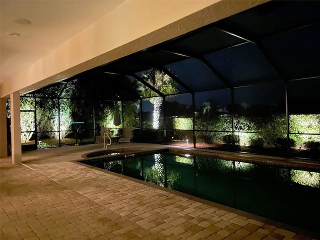 view of pool featuring a patio area and glass enclosure