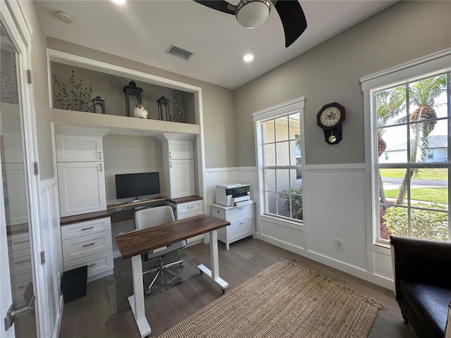 office space featuring a wainscoted wall, recessed lighting, visible vents, ceiling fan, and wood finished floors