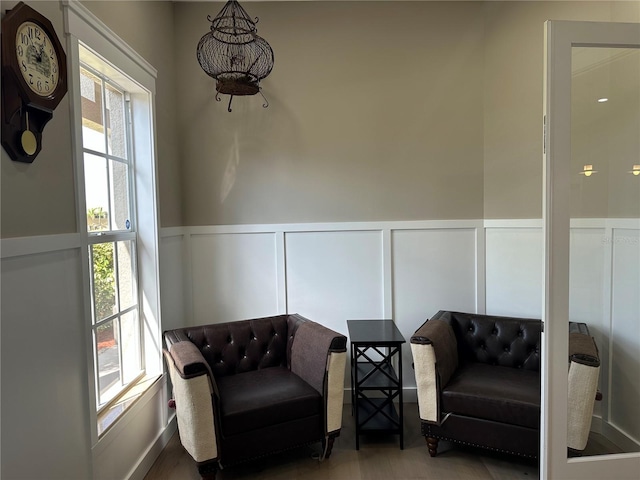 sitting room with a wainscoted wall