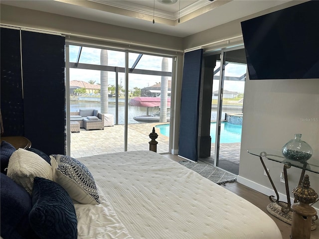 bedroom with access to outside, multiple windows, and crown molding