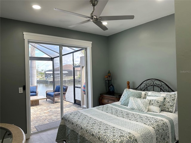 bedroom featuring ceiling fan, light wood-style flooring, recessed lighting, a sunroom, and access to outside