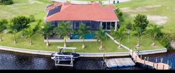 birds eye view of property with a water view