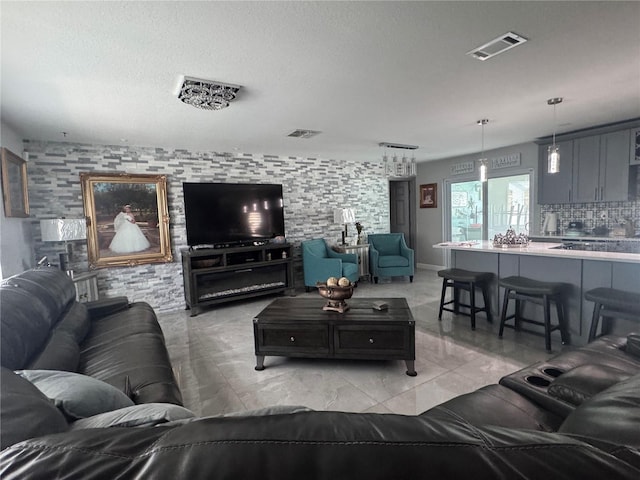 living room featuring a textured ceiling