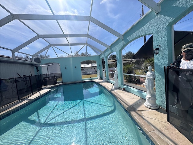 view of pool featuring a patio and a lanai