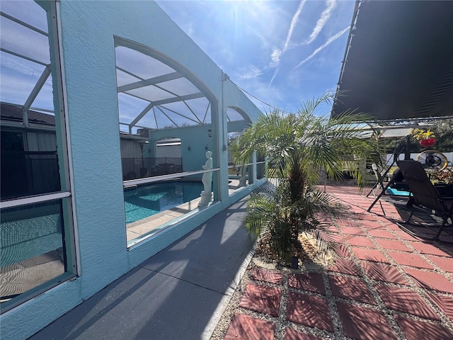 view of pool featuring a lanai and a patio area