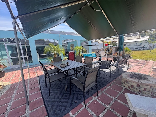 view of patio / terrace featuring a fire pit