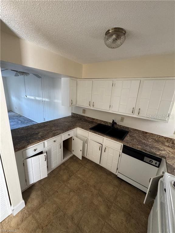 kitchen featuring sink, white cabinets, stove, white dishwasher, and a textured ceiling