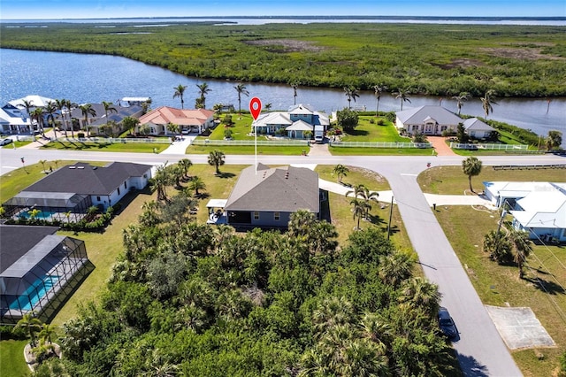 aerial view with a residential view and a water view