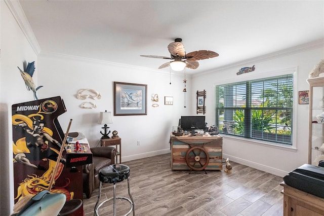 office with baseboards, wood finished floors, a ceiling fan, and crown molding