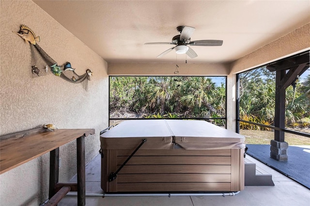 sunroom / solarium with ceiling fan and a healthy amount of sunlight