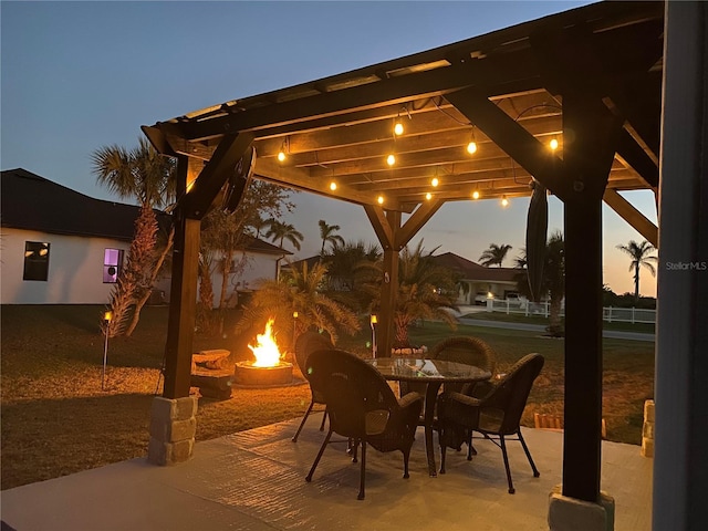 view of patio / terrace featuring an outdoor fire pit and a pergola