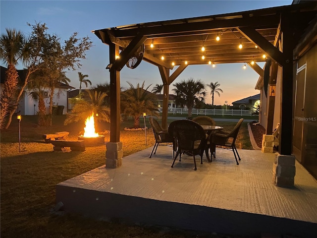 view of patio / terrace featuring a fire pit and a pergola