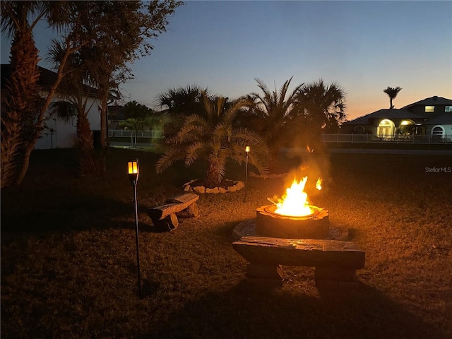 view of yard featuring an outdoor fire pit