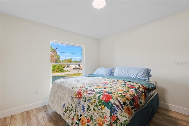 bedroom featuring hardwood / wood-style flooring