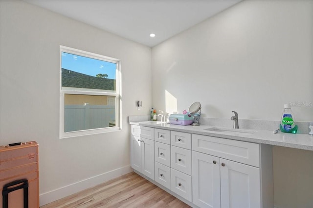 bathroom with vanity and hardwood / wood-style floors