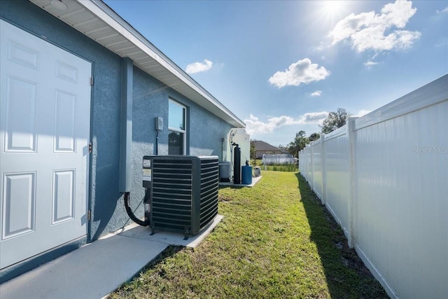 view of yard with central AC unit