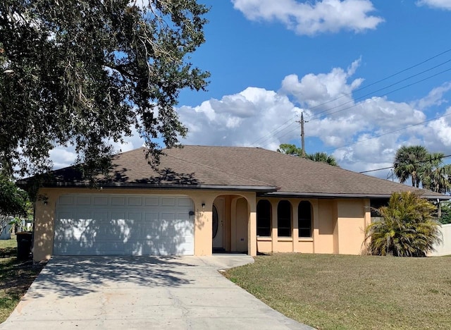 single story home with a garage and a front lawn