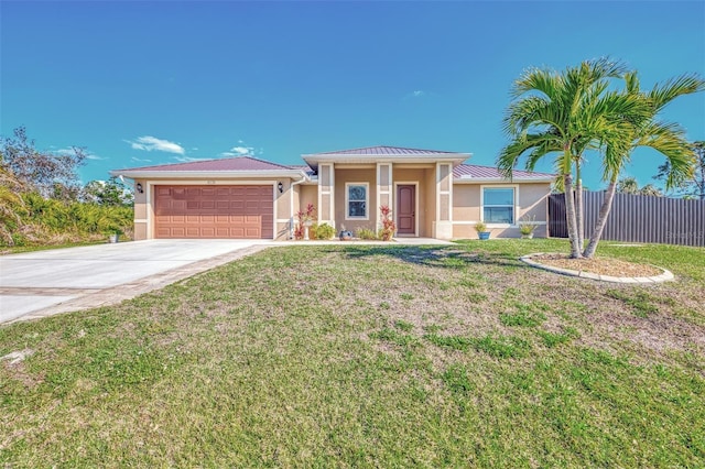 view of front of property with a garage and a front lawn