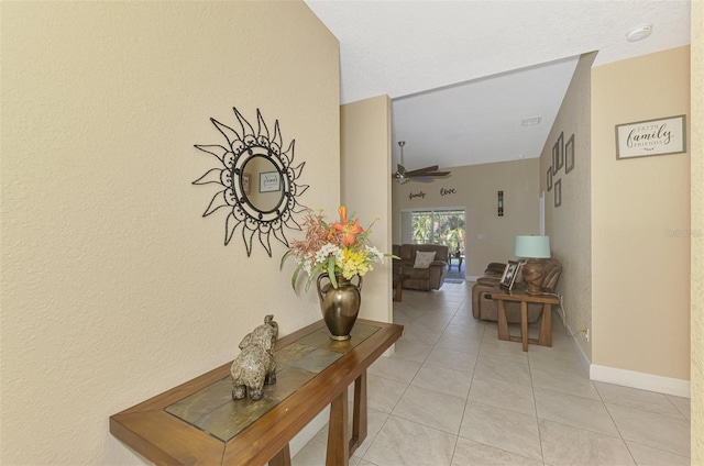 hallway featuring light tile patterned flooring