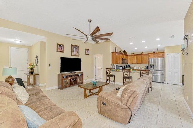 tiled living room with ceiling fan