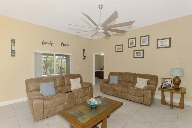 tiled living room with ceiling fan