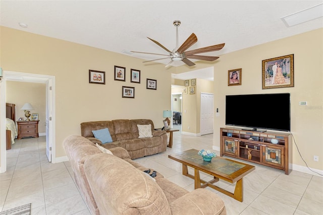 living room with light tile patterned floors and ceiling fan