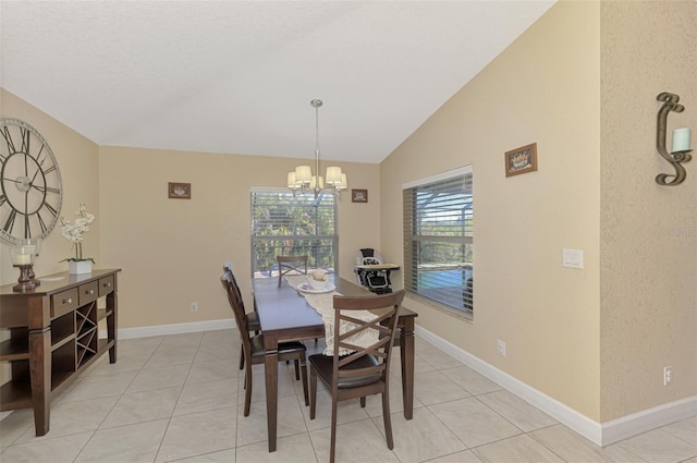 dining space with vaulted ceiling, light tile patterned floors, and a notable chandelier