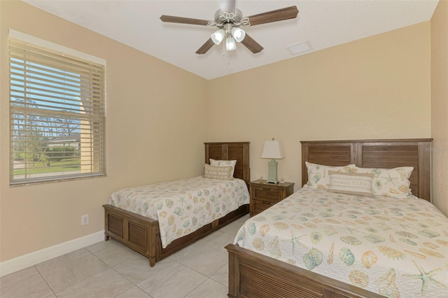 bedroom with light tile patterned floors and ceiling fan