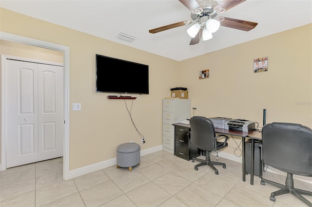 office featuring light tile patterned flooring and ceiling fan