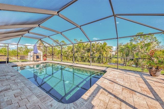 view of swimming pool with a patio and a lanai