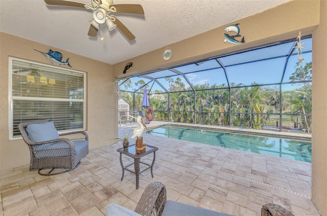 view of pool featuring ceiling fan