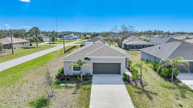 view of front of property featuring a garage and a front yard