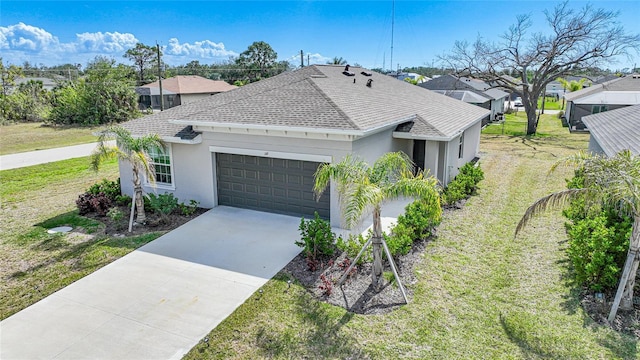 single story home featuring a garage and a front yard