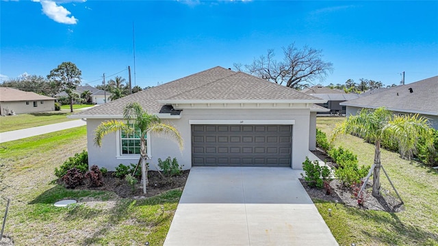 single story home featuring a garage and a front lawn