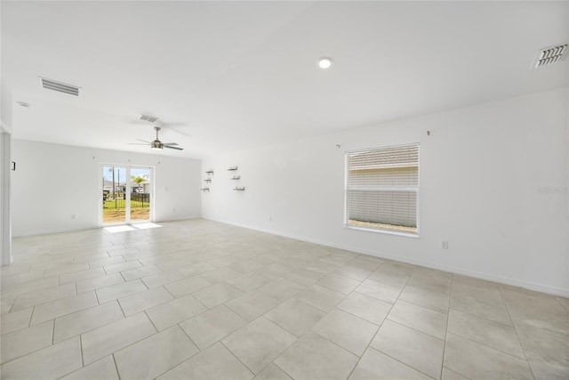 empty room featuring light tile patterned floors and ceiling fan