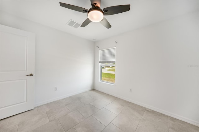 spare room with ceiling fan