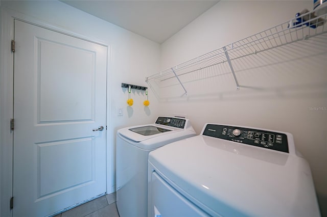 clothes washing area featuring separate washer and dryer