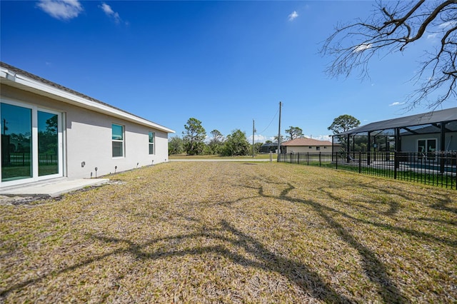 view of yard with a lanai