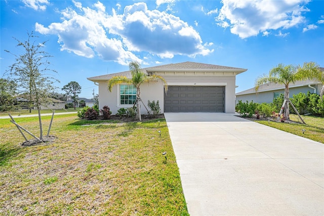 ranch-style house featuring a garage and a front yard