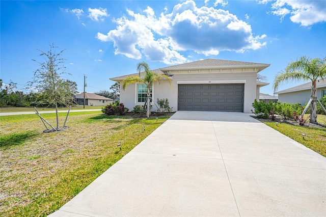 view of front facade with a garage and a front yard