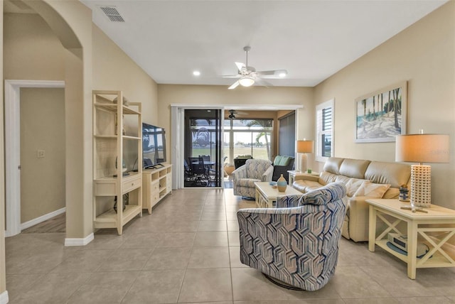 living room featuring ceiling fan and light tile patterned floors