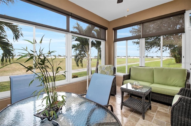 sunroom featuring a wealth of natural light and ceiling fan