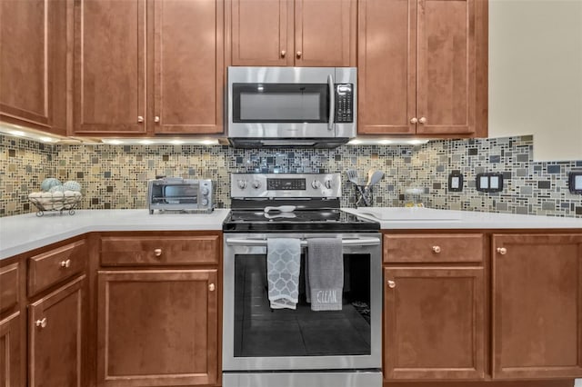 kitchen featuring appliances with stainless steel finishes and backsplash