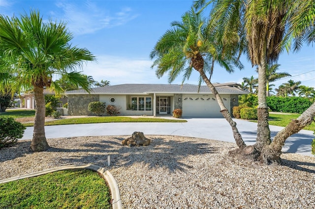 ranch-style home featuring a garage