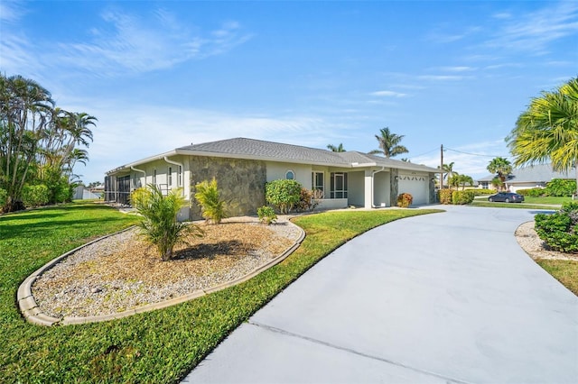 ranch-style house with a garage and a front lawn