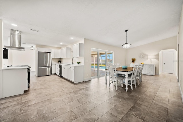 dining space with sink and a textured ceiling